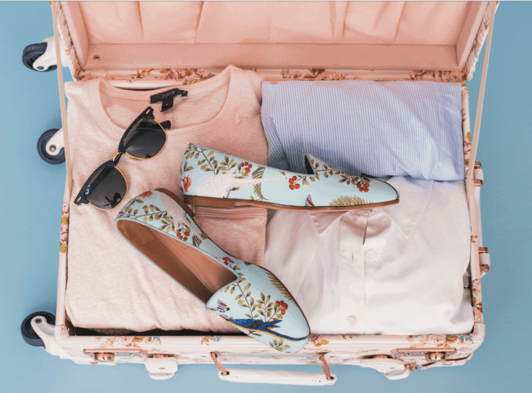 Packing for a Month in Europe? My Real-Life, 23-Pound Packing List 7 Suitcase packed with clothes